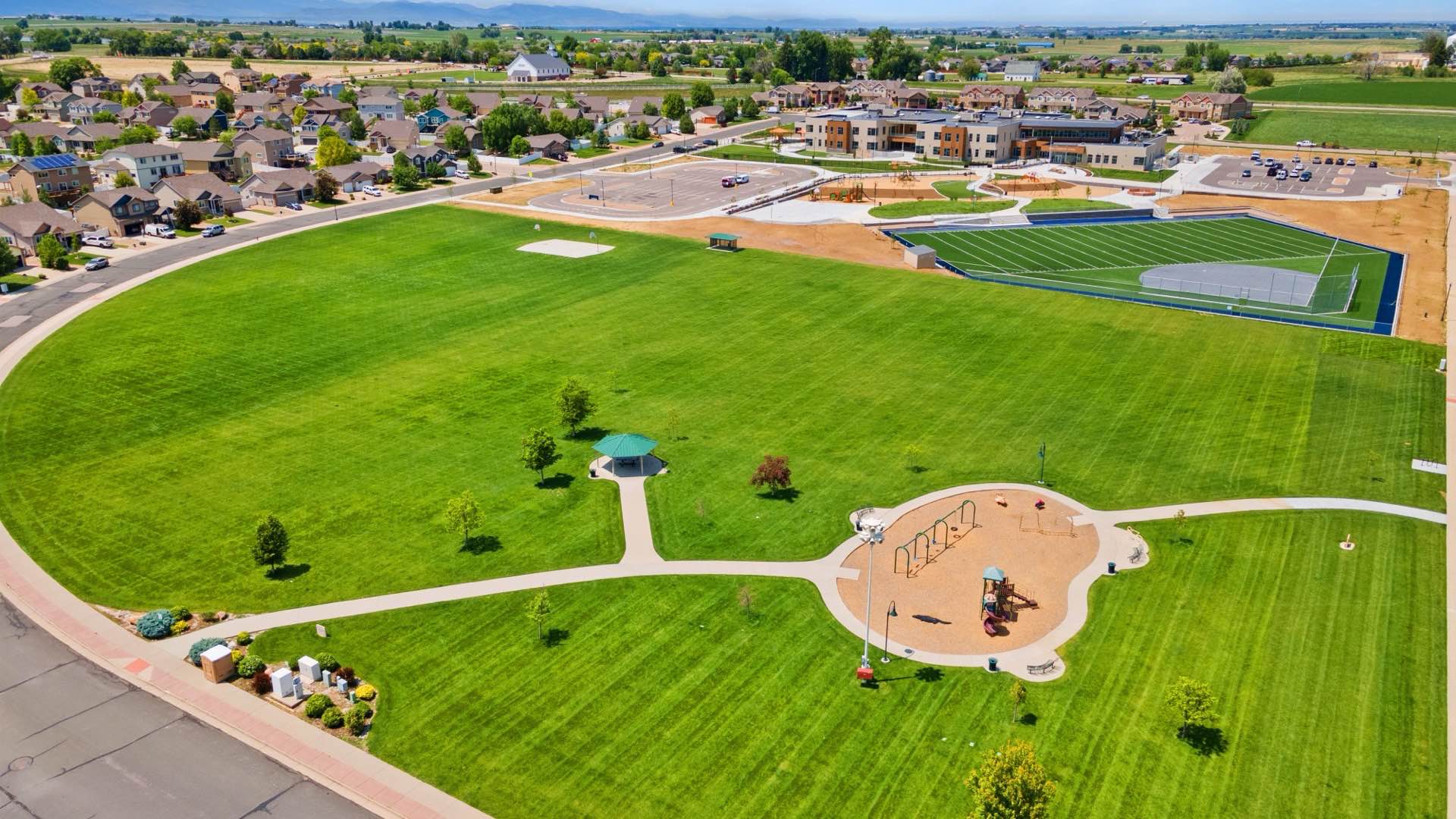 A town park with a playground and ball fields, seen from the air
